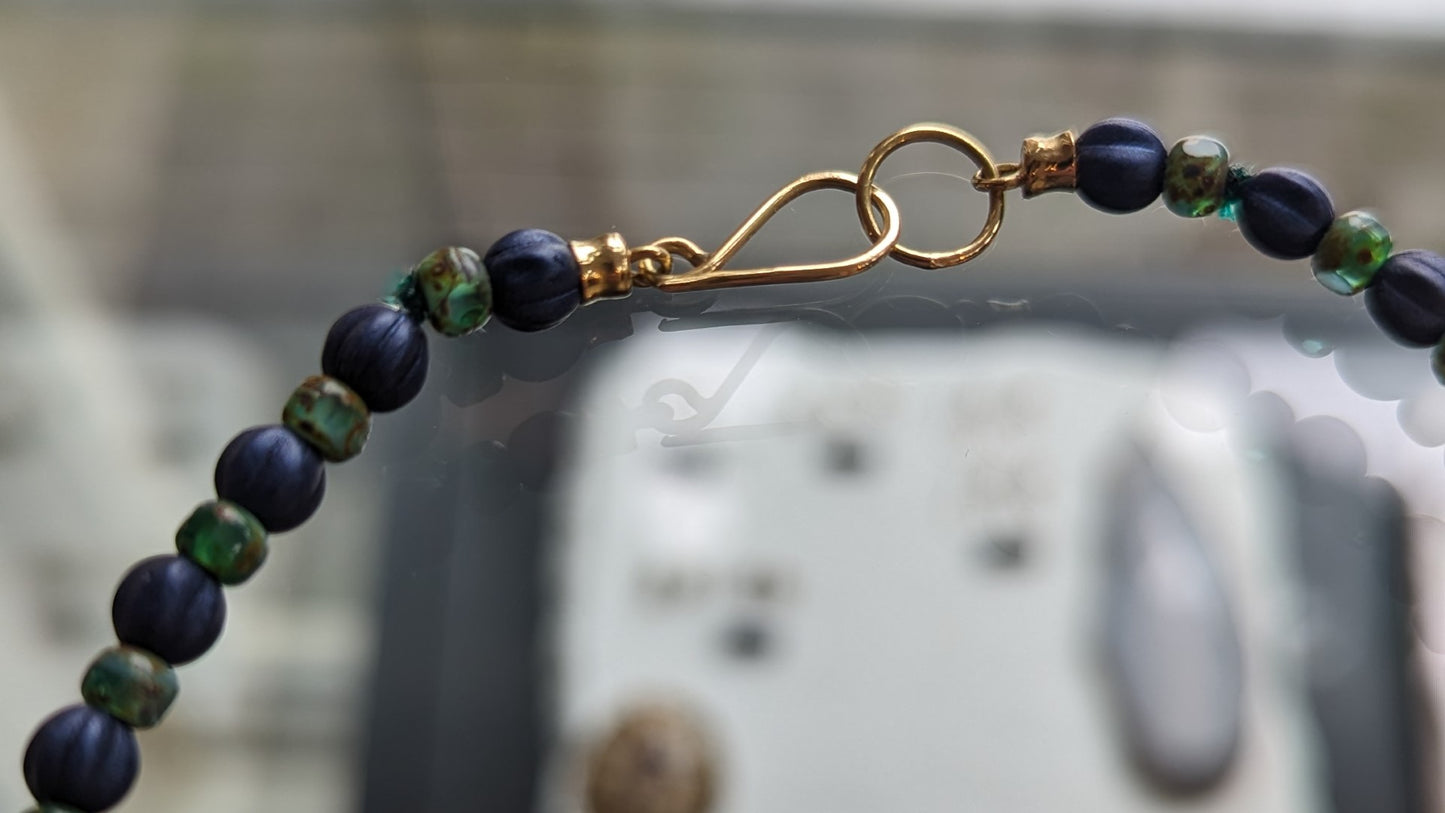 Collier goud en blauw-groen